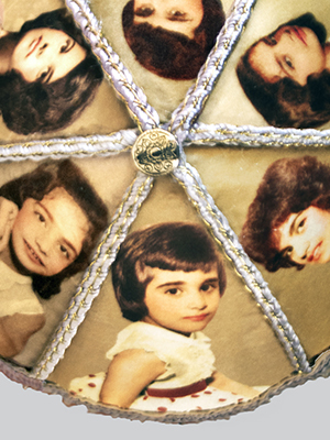 top view of Sister Fez piece. photographic images of girls are shown in pie shaped sections on the top of the round fez cap, separated by decorative cord