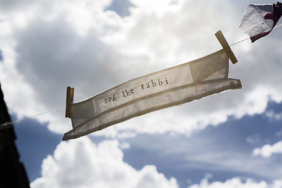 white shirt collar with words, "ask the rabbi," hanging out to dry