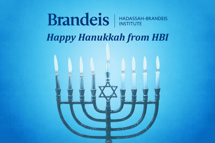 Logo text Brandeis, Hadassah-Brandeis Institute, text below: Happy Hanukkah from HBI Image below, a menorah with a Jewish star and eight lit candles plus a taller shamash candle in the middle