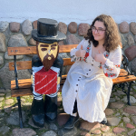 Miriam Abrams sitting on a bench overlooking the ocean