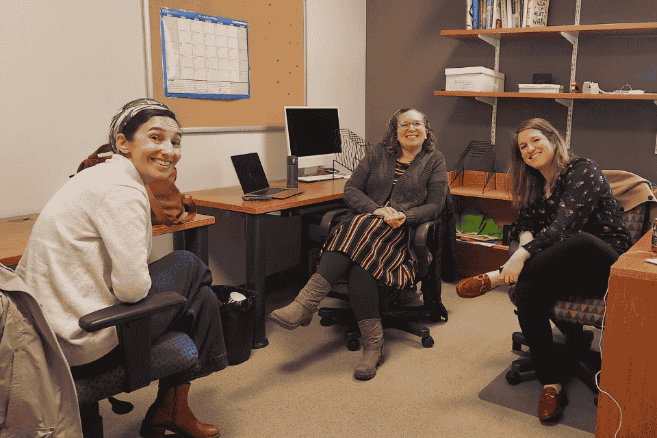 Three women sitting in an office