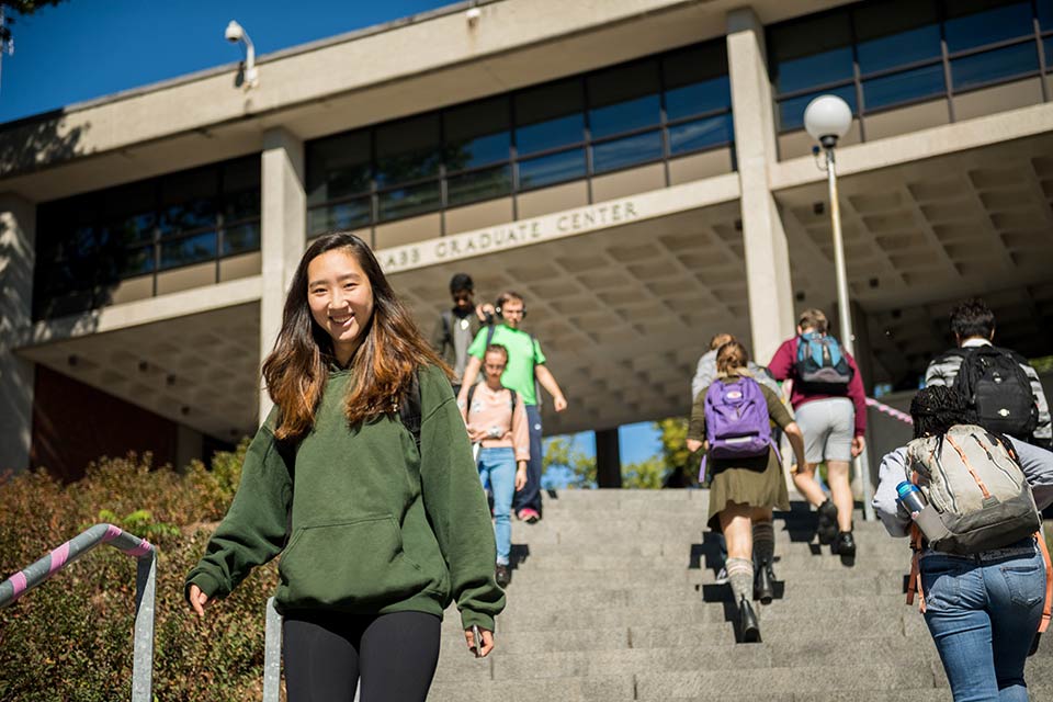 Rabb building and student walking up on steps