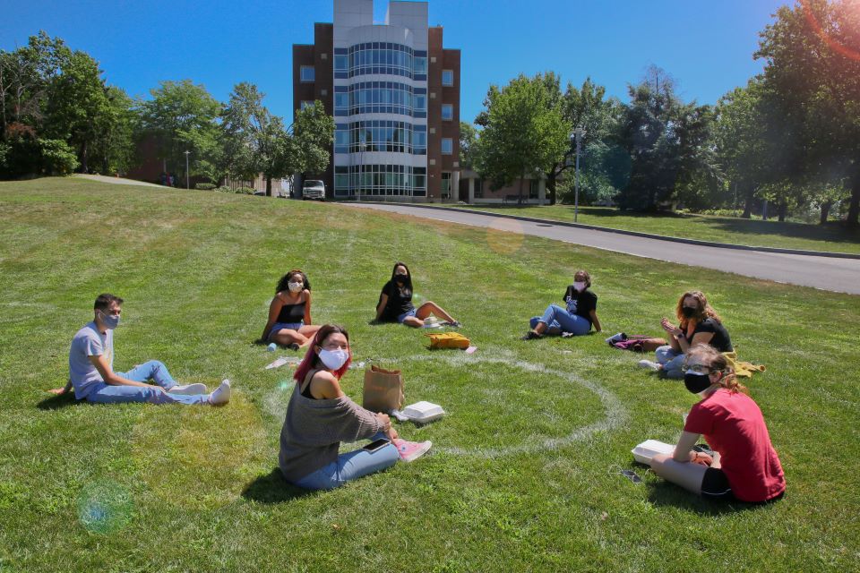 Students sitting on the lawn