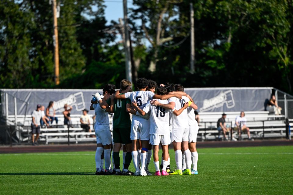 Men's soccer team huddle