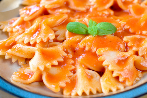 Image of bowtie pasta with red sauce