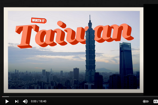 Screenshot of a video showing a postcard with the Taipei, Taiwan skyline