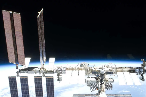 Image of the International Space Station in space with Earth in the background