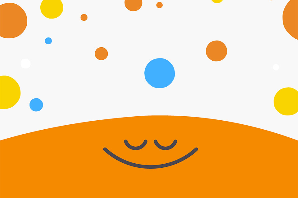 A orange half circle smiles with its eyes closed while colorful circles exist above it
