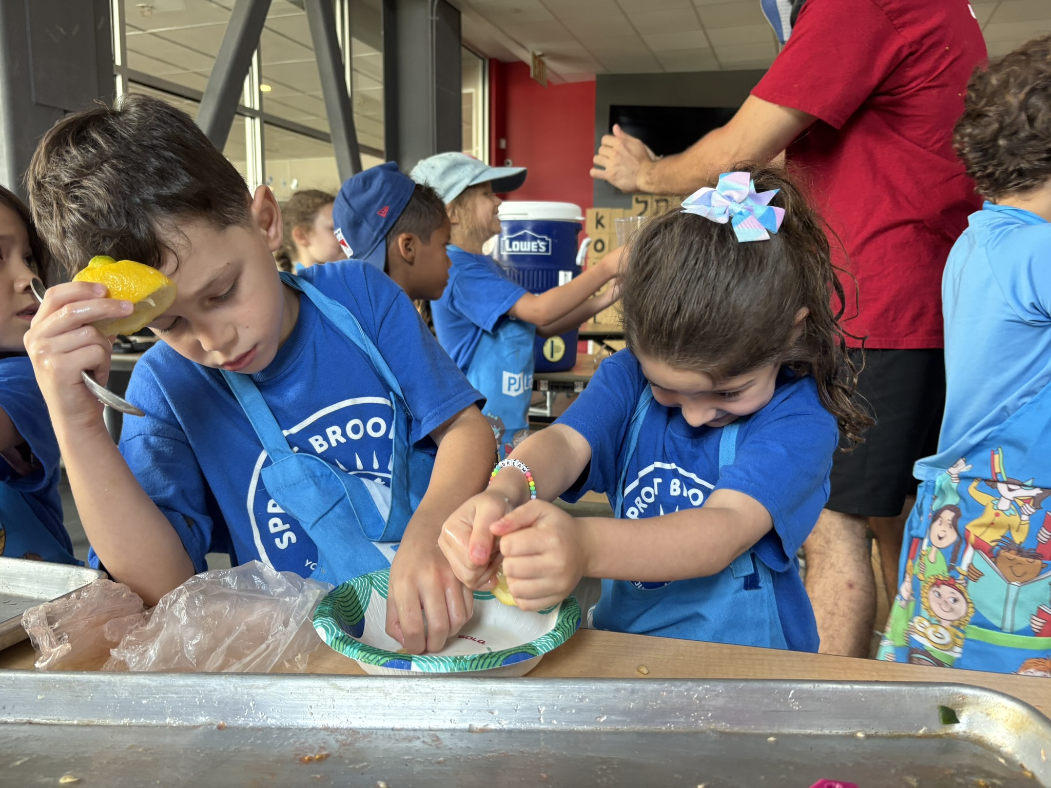 A photo of kids making salad
