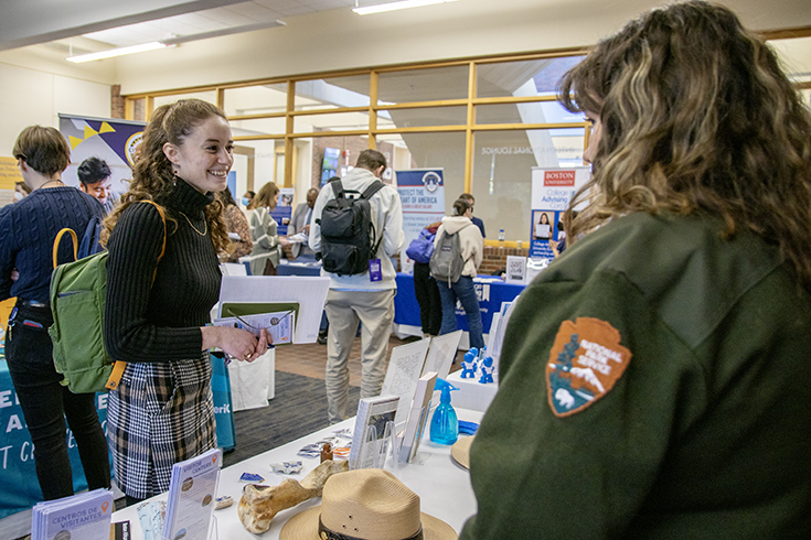 A student meets with an employer during a career fair