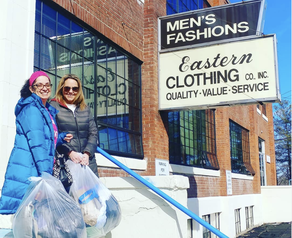 Hiatt staff members in front of Eastern Clothing, Co