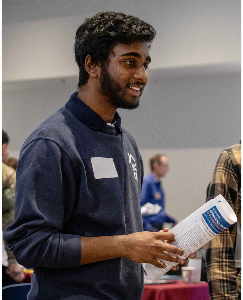 A student chats with an employer during the 2022 Government & Public Service Career Fair