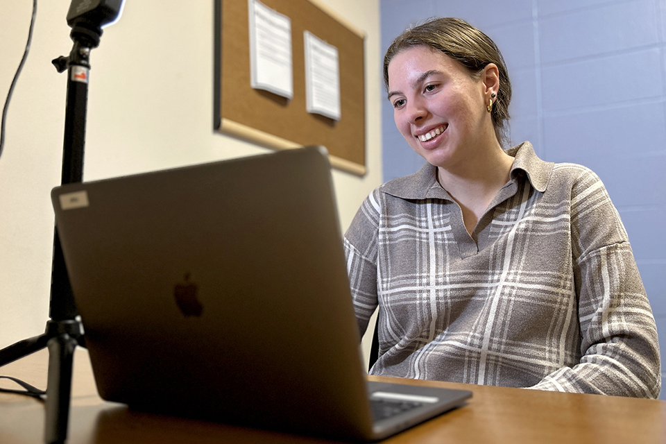 A student uses Handshake on a laptop.