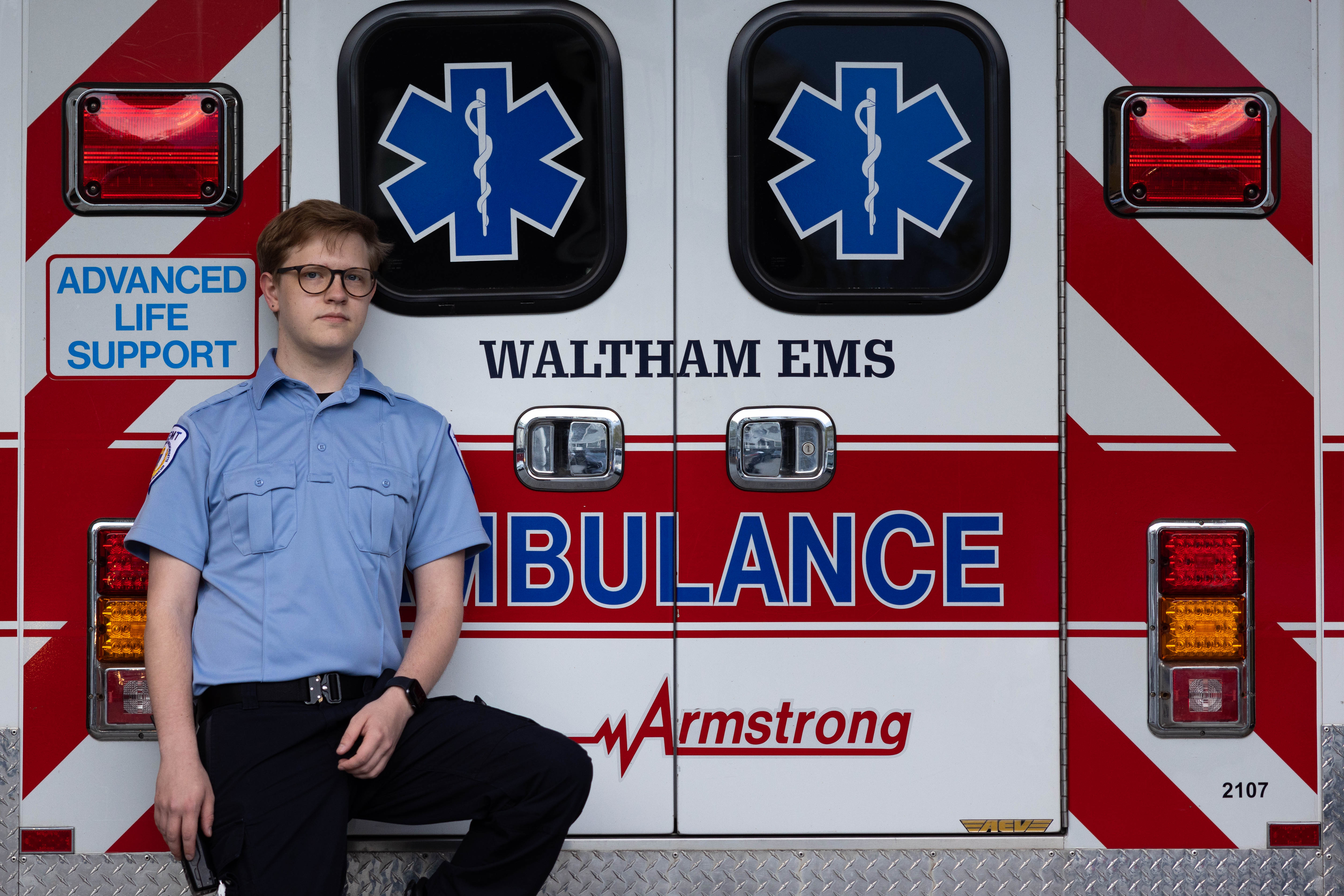Brandeis University and BEMCo member, Lorrin Stone, ’23, poses for a portrait at the start of his shift as an EMT with Armstrong Ambulance service in Waltham, Mass., on April 15, 2023. Photo/Gaelen Morse