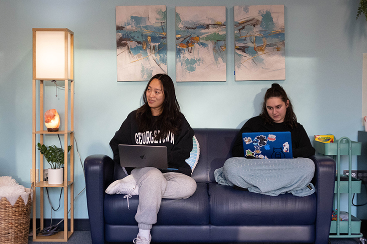 Tao ’25 (left) and Alexandra Diener ’24 (right) enjoy the new Oasis Wellness Lounge in the Shapiro Campus Center (Photo/Dan Holmes).