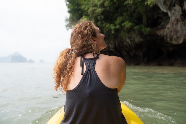 woman in a canoe on a river