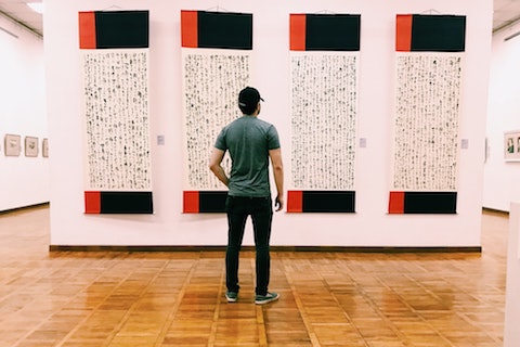 Person looking at art in museum