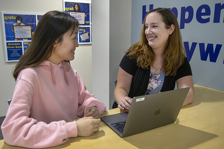 A student meets with Jessica Smith