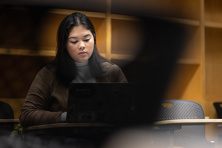 Amelia Trahan '24 works in her class "Medieval Women in Print” at Brandeis University on January 26, 2023. Photo/Dan Holmes