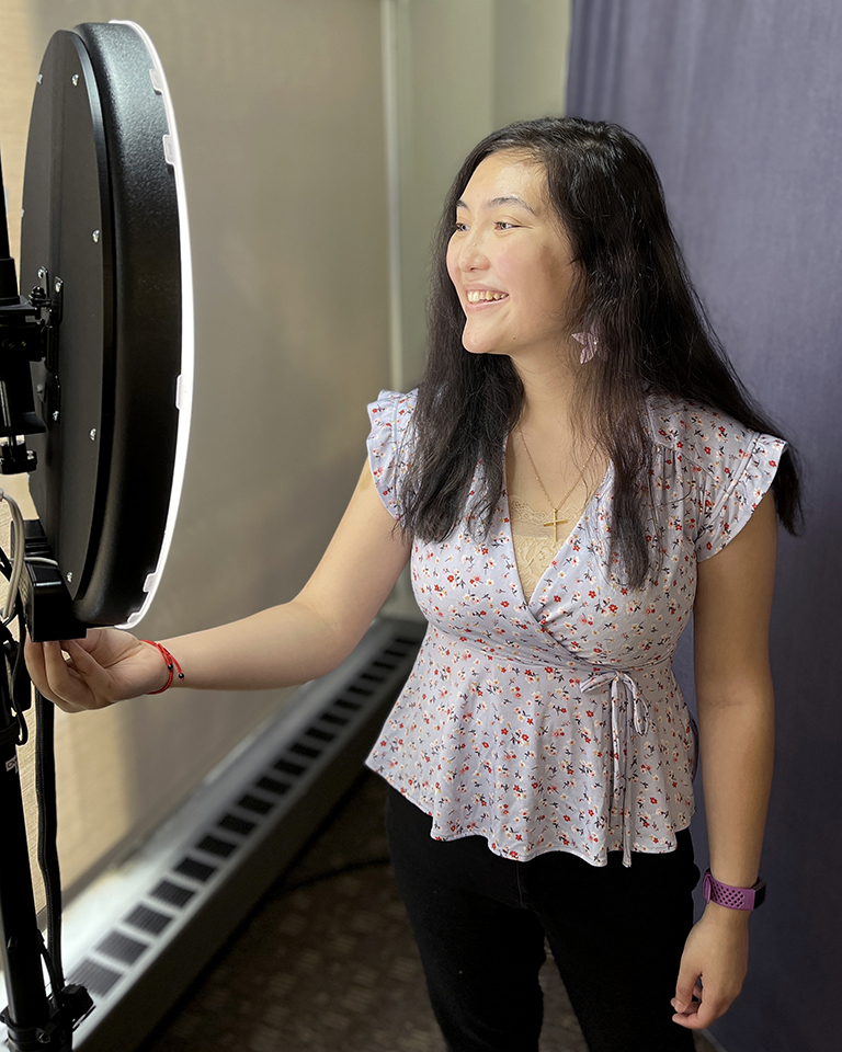 A student uses the LinkedIn Photo Booth