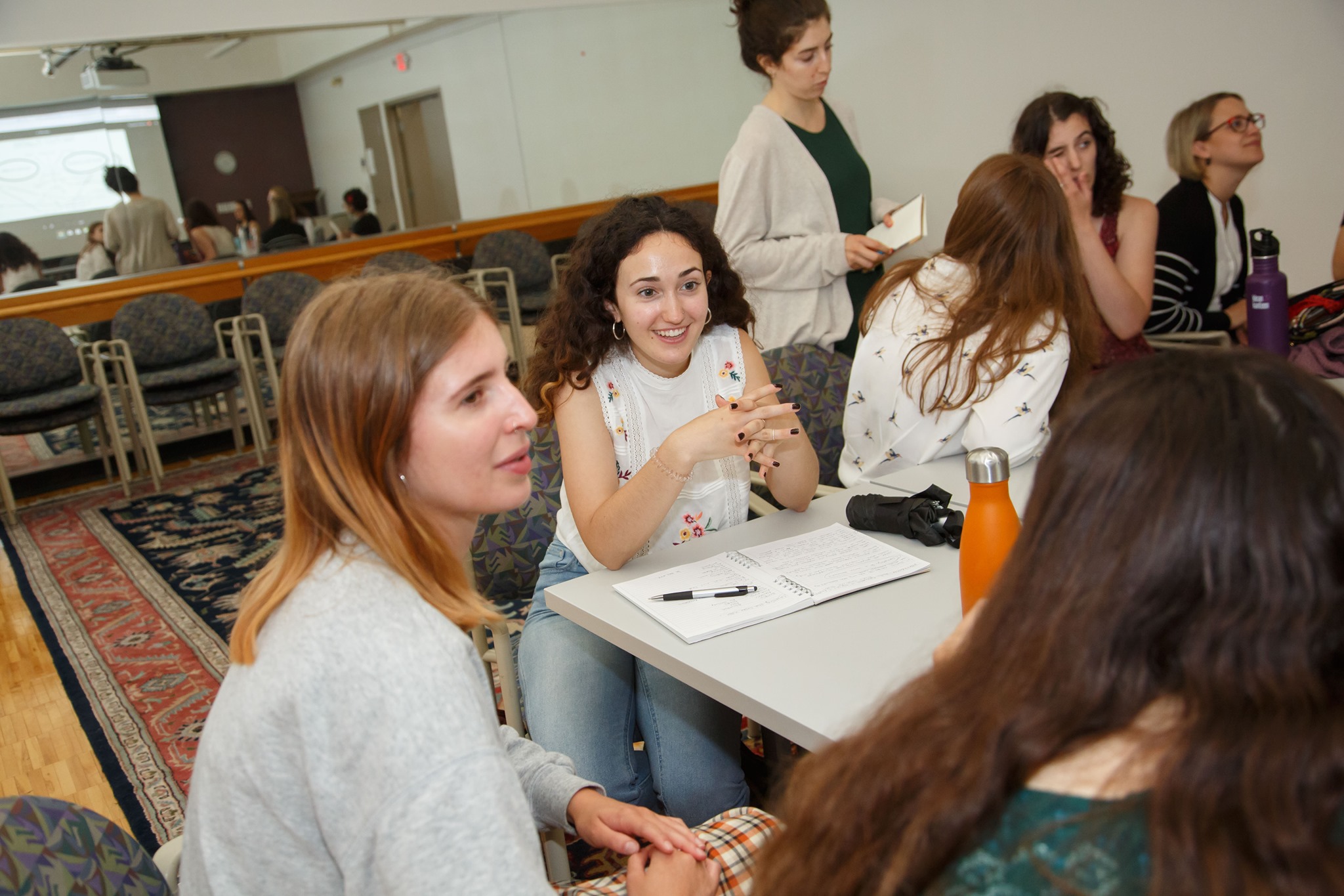 Students talking around a table