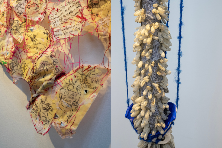 on the left, Roya Amigh's piece made of paper and cloth tinted yellow with red threads running though it and black threads in the shape of people. On the right, Dell Hamilton's piece, hanging by blue thick thread, made of finger cots simulating a spine, sitting on a blue pelvis.