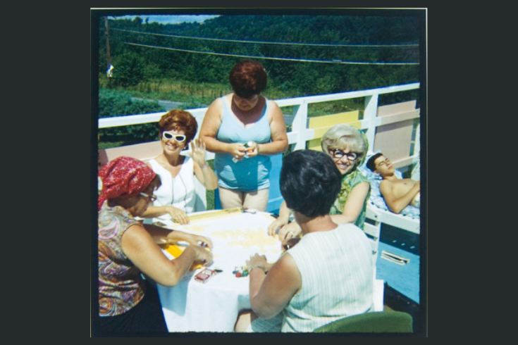 Five women at a summer resort in the 1960s playing mahjong