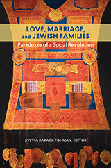 Book Cover: Love, Marriage, and Jewish Families (on a yellow stripe). Paradoxes of a Social Revolution.  Sylvia Barack Fishman, Editor. Cover Art is a collage of patterns, shapes, Hebrew text (including several small scrolls tucked into 2 pockets) and symbols (fish and a Hamsa), all in shades of orange, yellow and blue.  15 circles and fish hang on strings below the main part of this work.  It is in the shape of a vest.