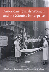 Book Cover. A black and white in the background depicts photo of 2 nurses holding an Israeli flag between them parallel to the sidewalk, while standing on a street in NYC next to an ambulance with a sign that says: "Give life to the people of Israel. This ambulance filled with medical supplies will be flown to Haifa.  Another woman, standing on a stool is perched between an American flag and an Israeli flag.  A crowd of people is watching. Text on red stripe reads: American Jewish Women and the Zionist Enterprise.  Edited by Shulamit Reinharz and Mark A. Raider. 
