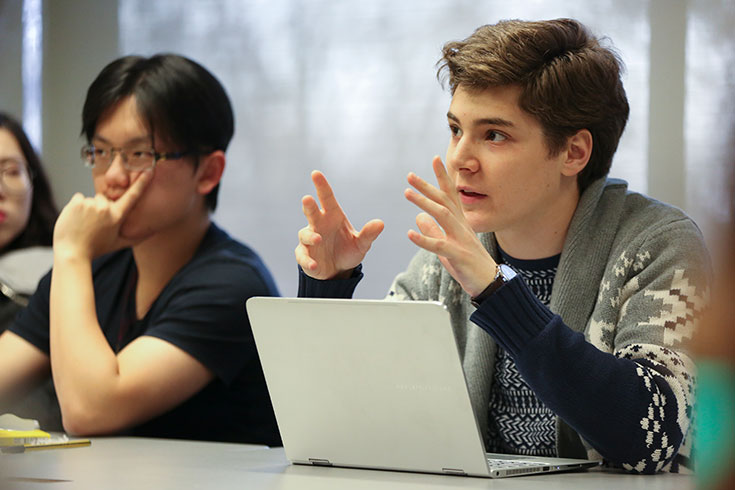 A student participates in the discussion during an undergraduate History class