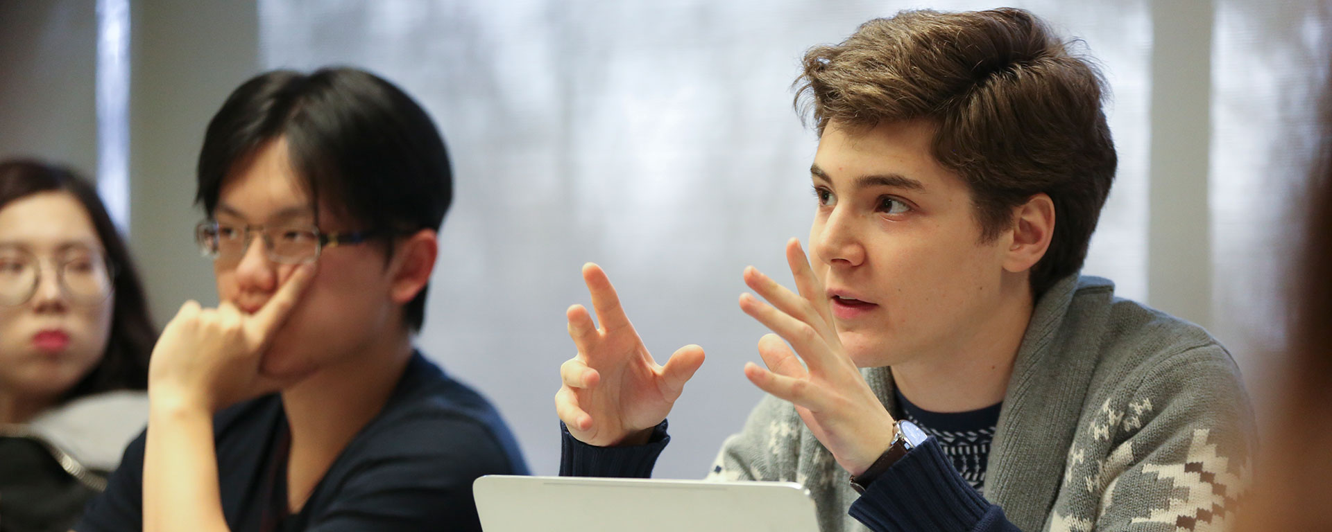 A student participates in the discussion during an undergraduate History class