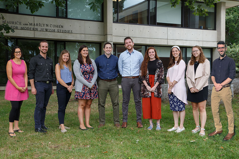 Class of 2021 Hornstein graduate students in a group outside on the lawn