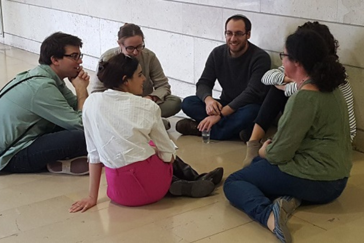 Hornstein students sitting in a circle on the floor at the Kraft Seminar in Israel