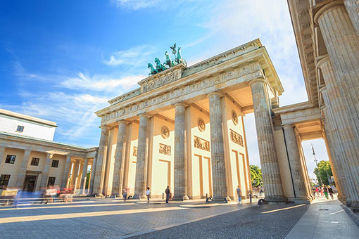 People walking around the Brandenburg Gate in Berlin