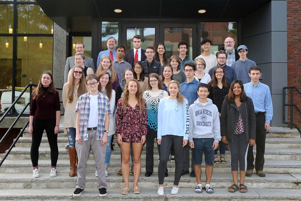 Group of Humanities Fellows pose on some outdoor steps