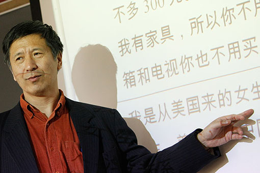 Professor teaching Asian language at blackboard