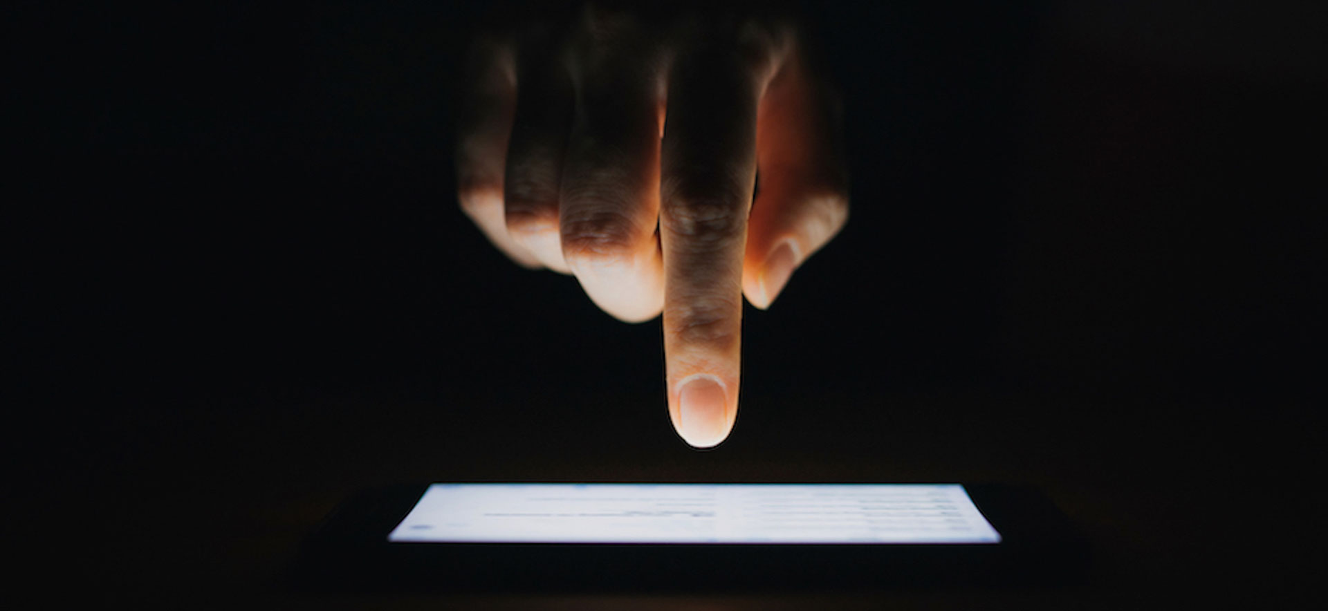 A finger pointed over a smart phone screen