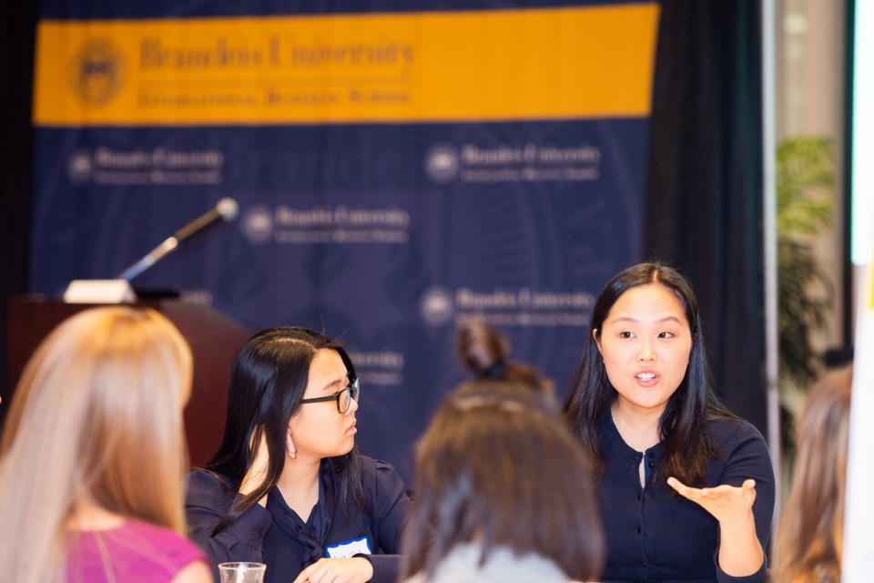 Woman speaking to group of students