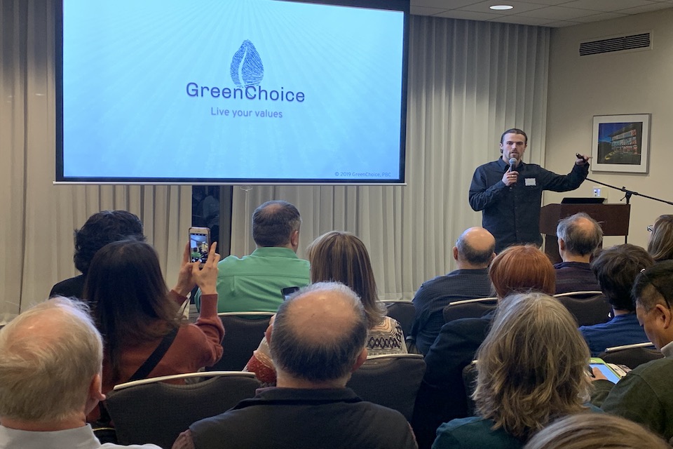 Galen Karlan-Mason presenting Greenchoice to audience