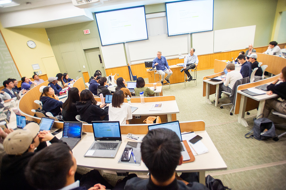 Students gather in a lecture hall