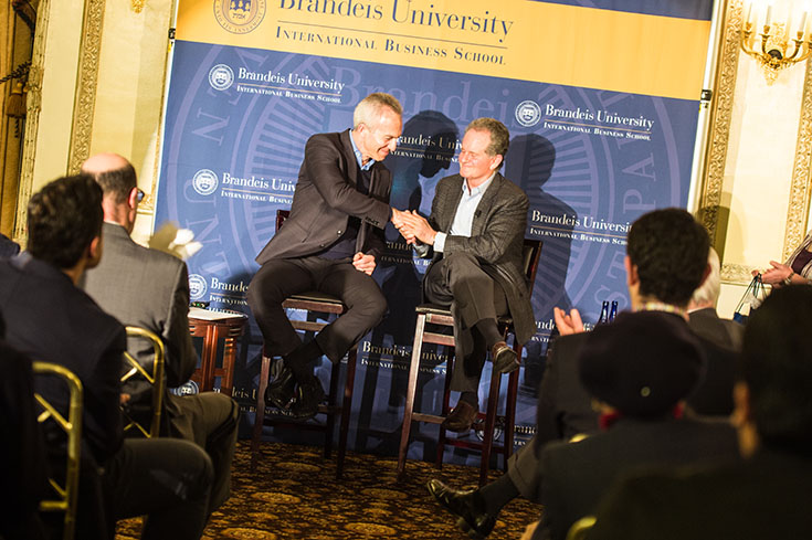 An alumni presents with a current Brandeis Professor at a talk