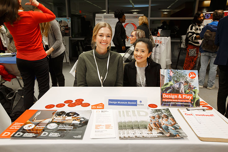 Company representatives in a boot at the Brandeis Career Fair