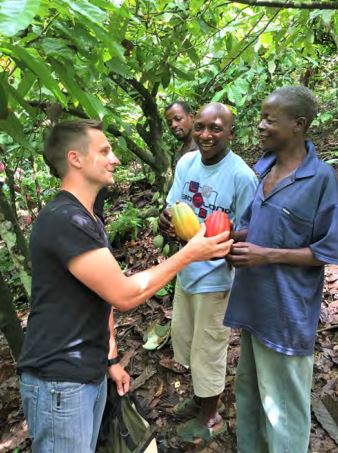 Moka Origins Photo of Jeff and Farmers holding cacao pods