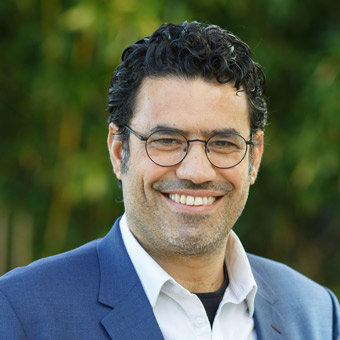 Man in blue shirt smiling