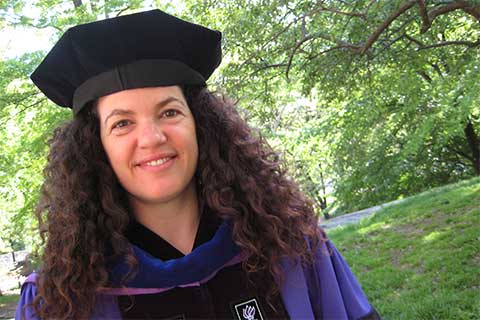 Ilana Szobel in cap and gown at NYU commencement