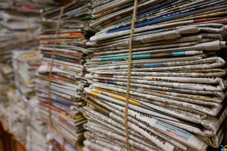 Stacked newspapers