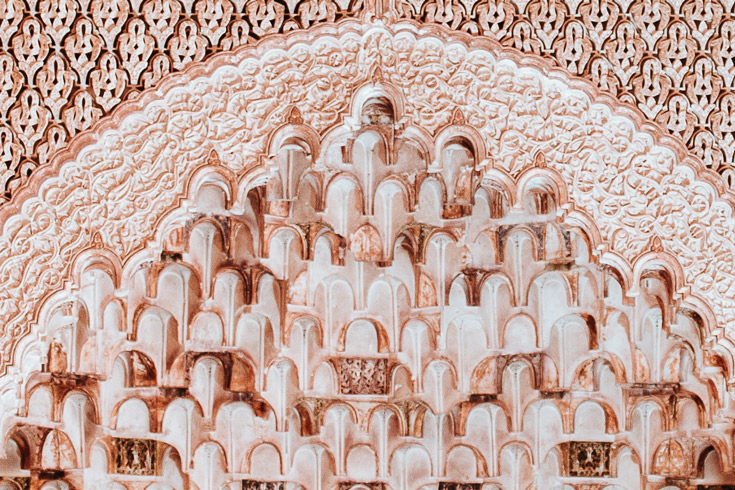 Architectural detail of an intricately carved archway in a mosque