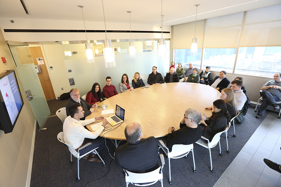 Schusterman Scholars Seminar taking place around table in Schusterman Center seminar room