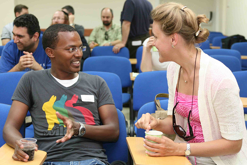 Two summer institute participants in an animated conversation