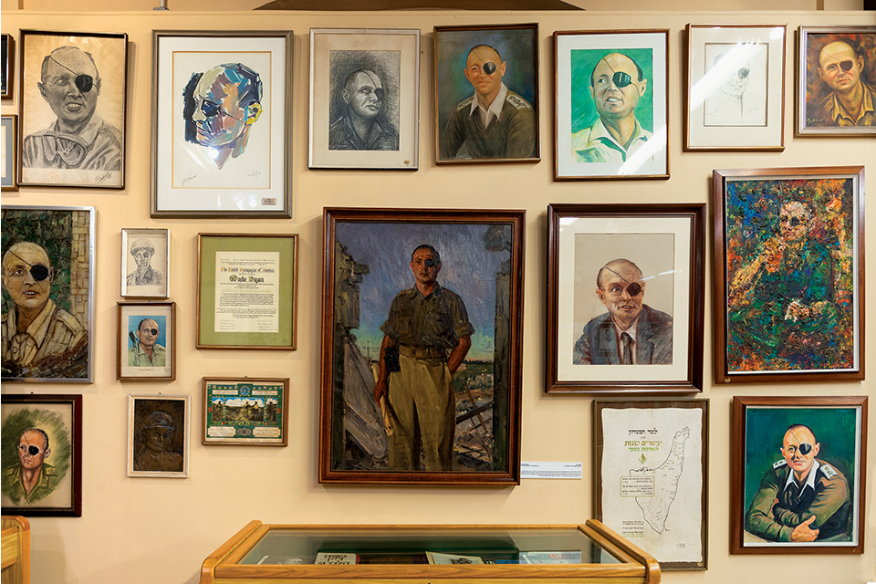 Many framed portraits, in different styles, of a man with an eye patch